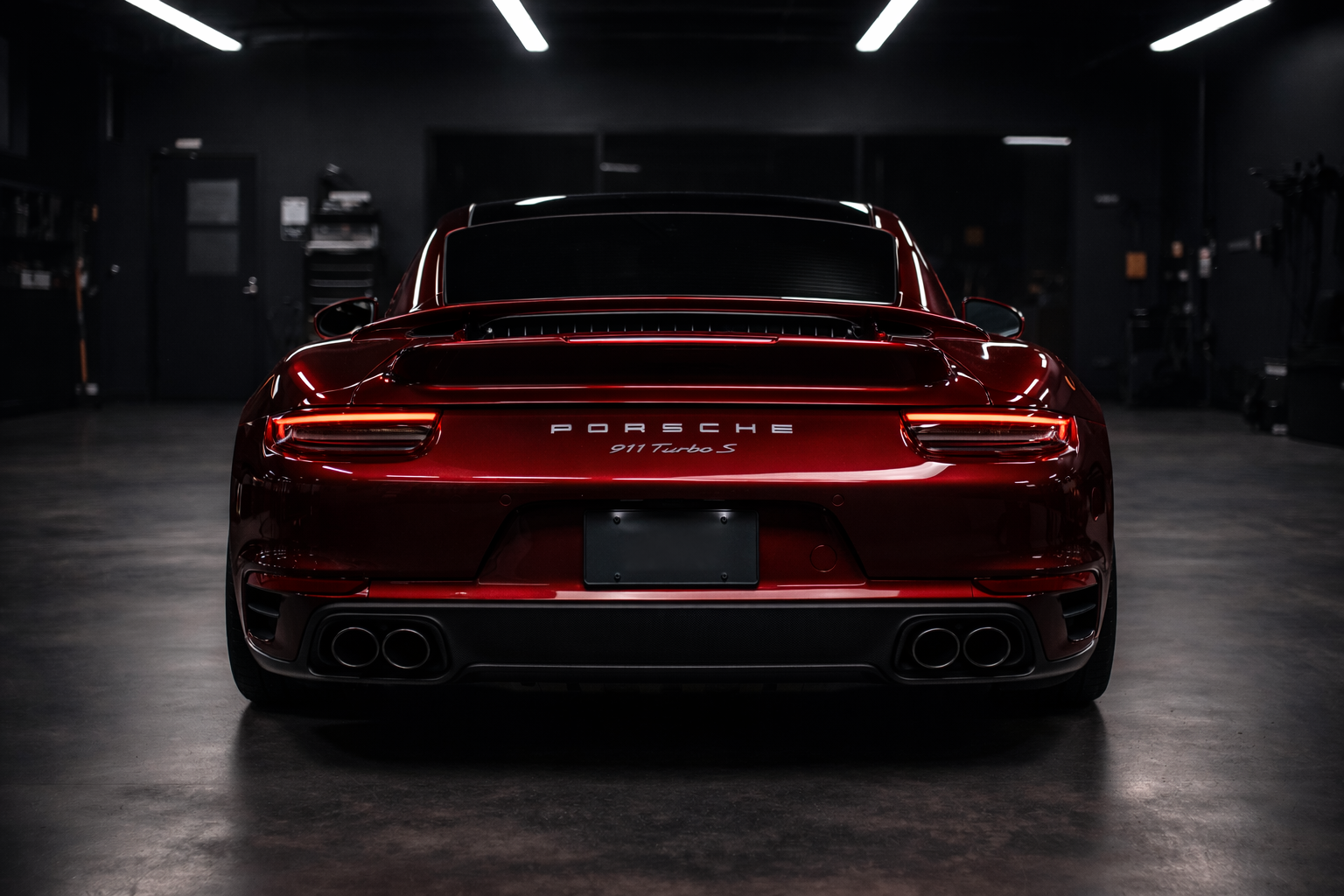 Red Porsche car in a dark garage